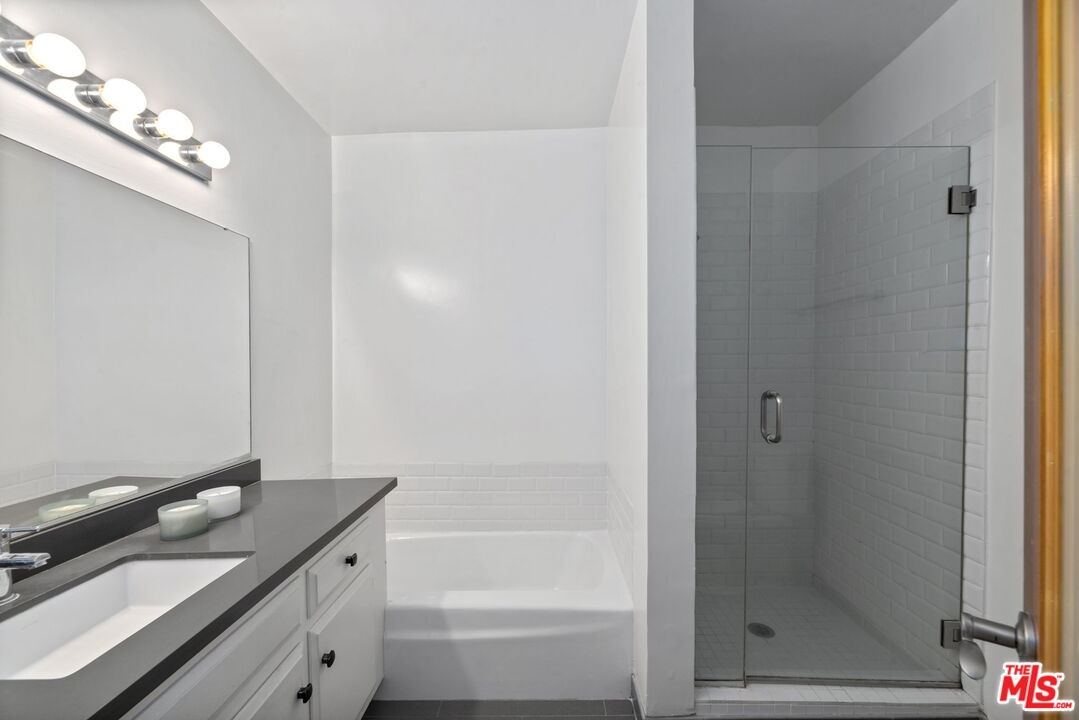 8710 Delgany Avenue, Unit 3 Playa del Rey, CA 90293 - Photo 17 of 21 a bathroom with a bathtub and a shower