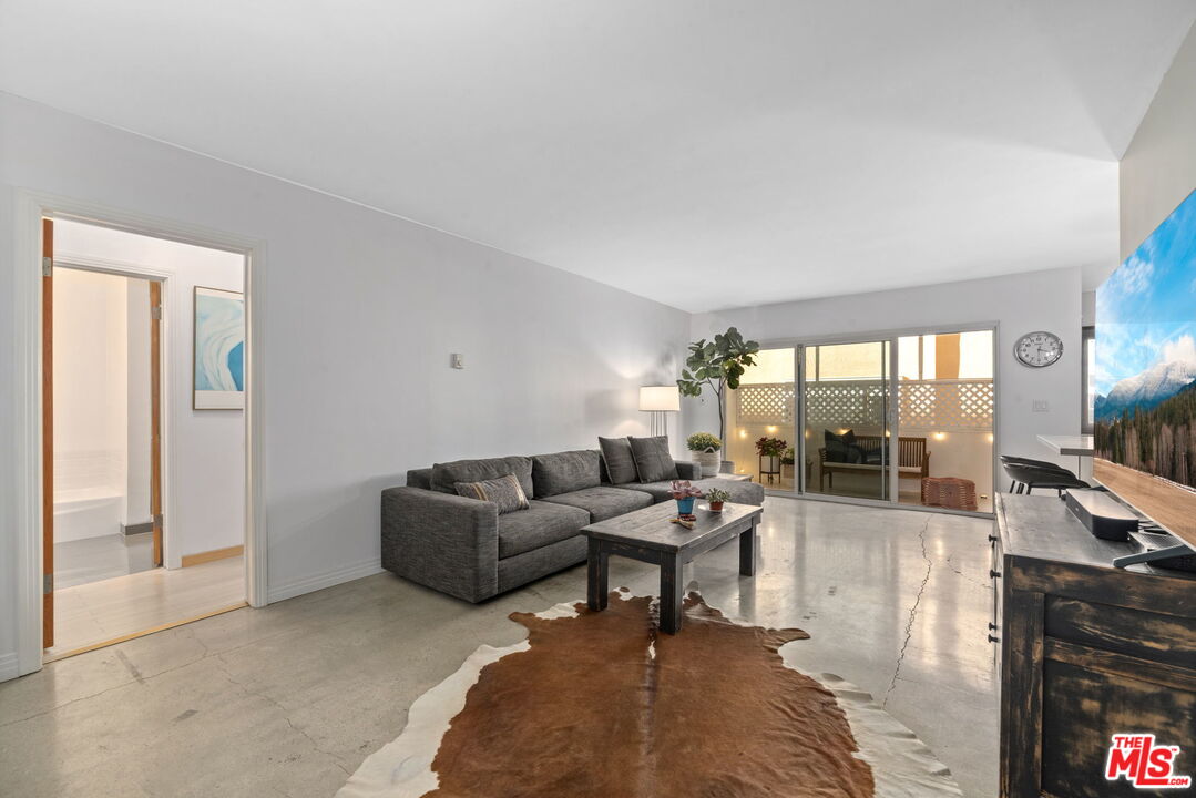 8710 Delgany Avenue, Unit 3 Playa del Rey, CA 90293 - Photo 3 of 21 a living room with furniture and a large window