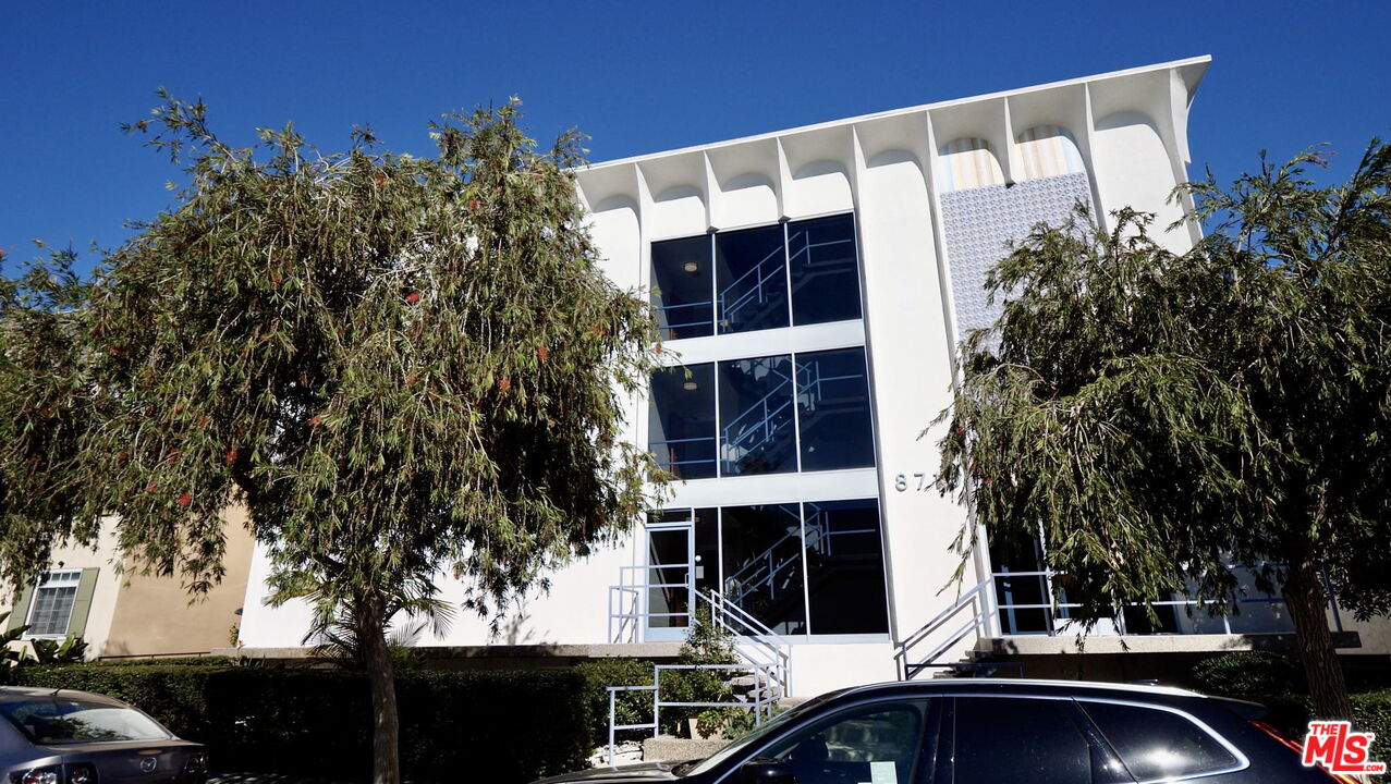 8710 Delgany Avenue, Unit 3 Playa del Rey, CA 90293 - Photo 21 of 21 a couple of cars parked in front of a building
