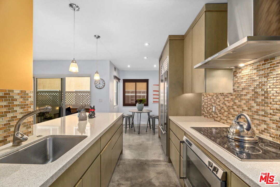 8710 Delgany Avenue, Unit 3 Playa del Rey, CA 90293 - Photo 6 of 21 a kitchen with sink stove and cabinets