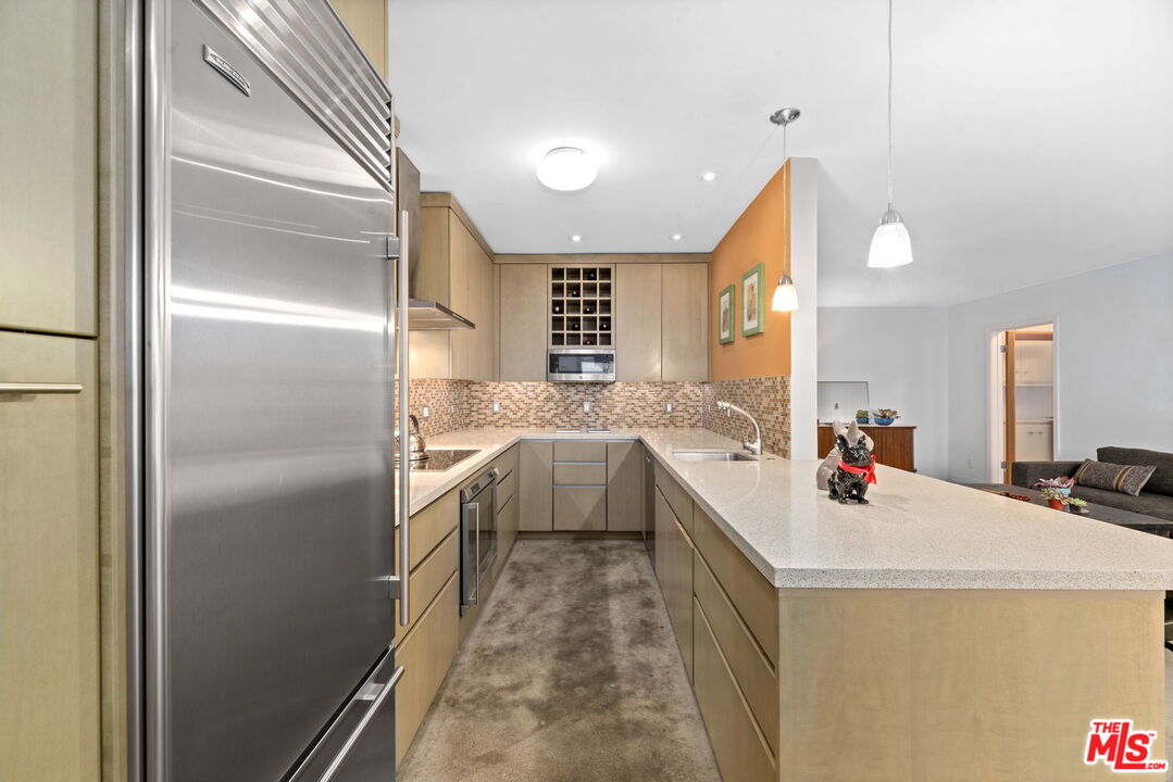 8710 Delgany Avenue, Unit 3 Playa del Rey, CA 90293 - Photo 7 of 21 a kitchen with a sink appliances and cabinets