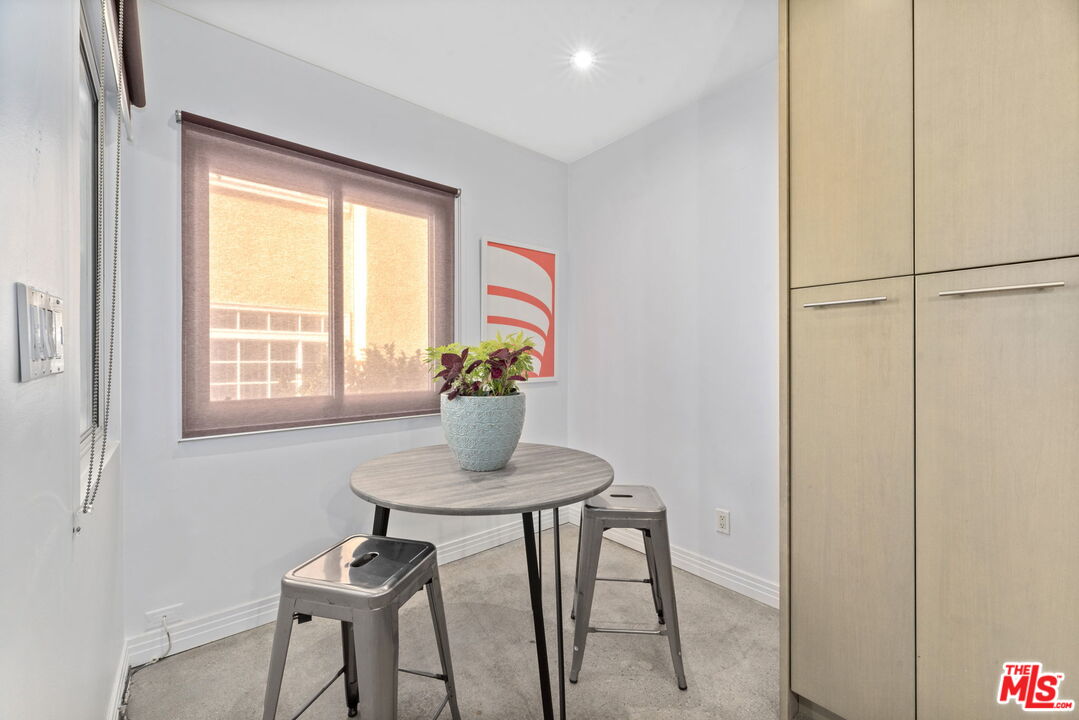 8710 Delgany Avenue, Unit 3 Playa del Rey, CA 90293 - Photo 10 of 21 a dining room with furniture and window