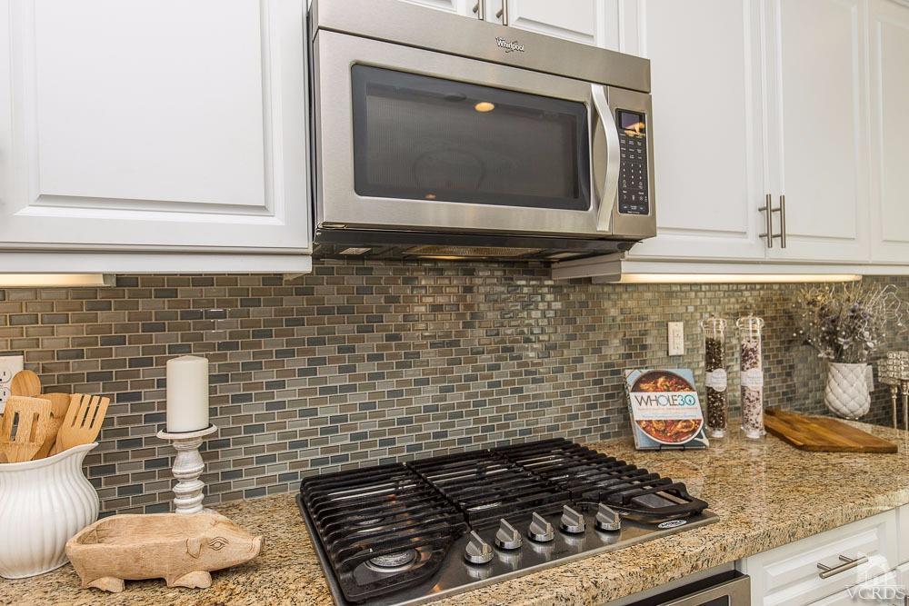 4885 Edenbridge Road Moorpark, CA 93021 - Photo 15 of 30 a kitchen with a stove and a microwave