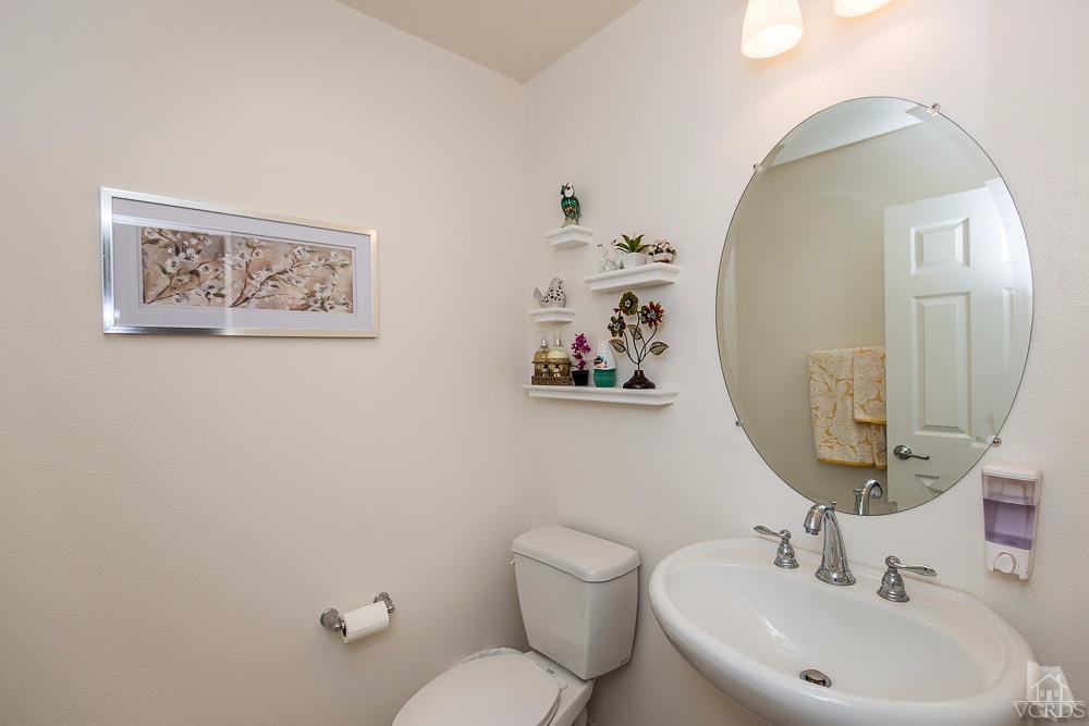 4885 Edenbridge Road Moorpark, CA 93021 - Photo 17 of 30 a bathroom with a toilet a sink and mirror