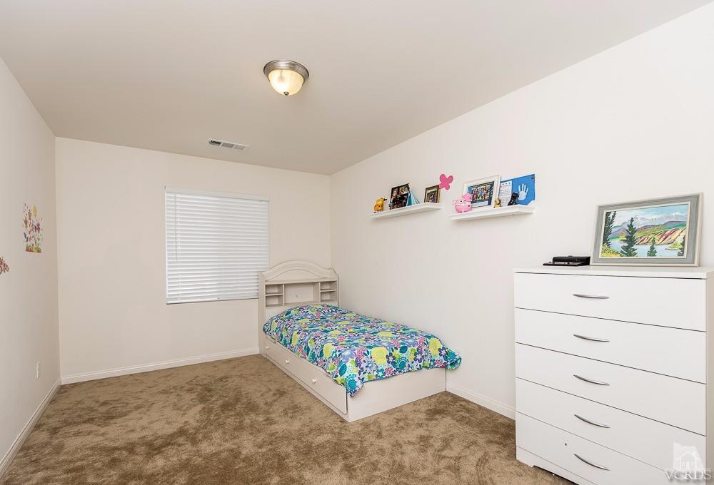 4885 Edenbridge Road Moorpark, CA 93021 - Photo 20 of 30 a bedroom with a bed and a window