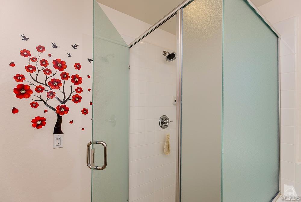 4885 Edenbridge Road Moorpark, CA 93021 - Photo 26 of 30 a bathroom with a white shower curtain