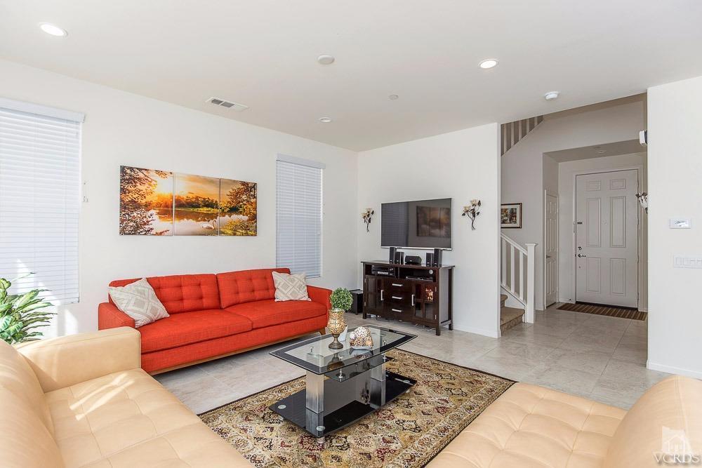 4885 Edenbridge Road Moorpark, CA 93021 - Photo 8 of 30 a living room with furniture a rug and a flat screen tv