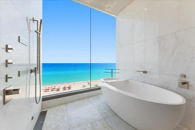 a bathroom with a bathtub and shower