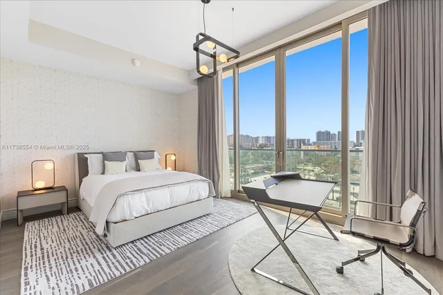 a spacious bedroom with a bed and a large window