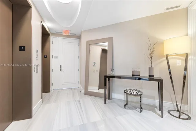 a view of a hallway with seating area