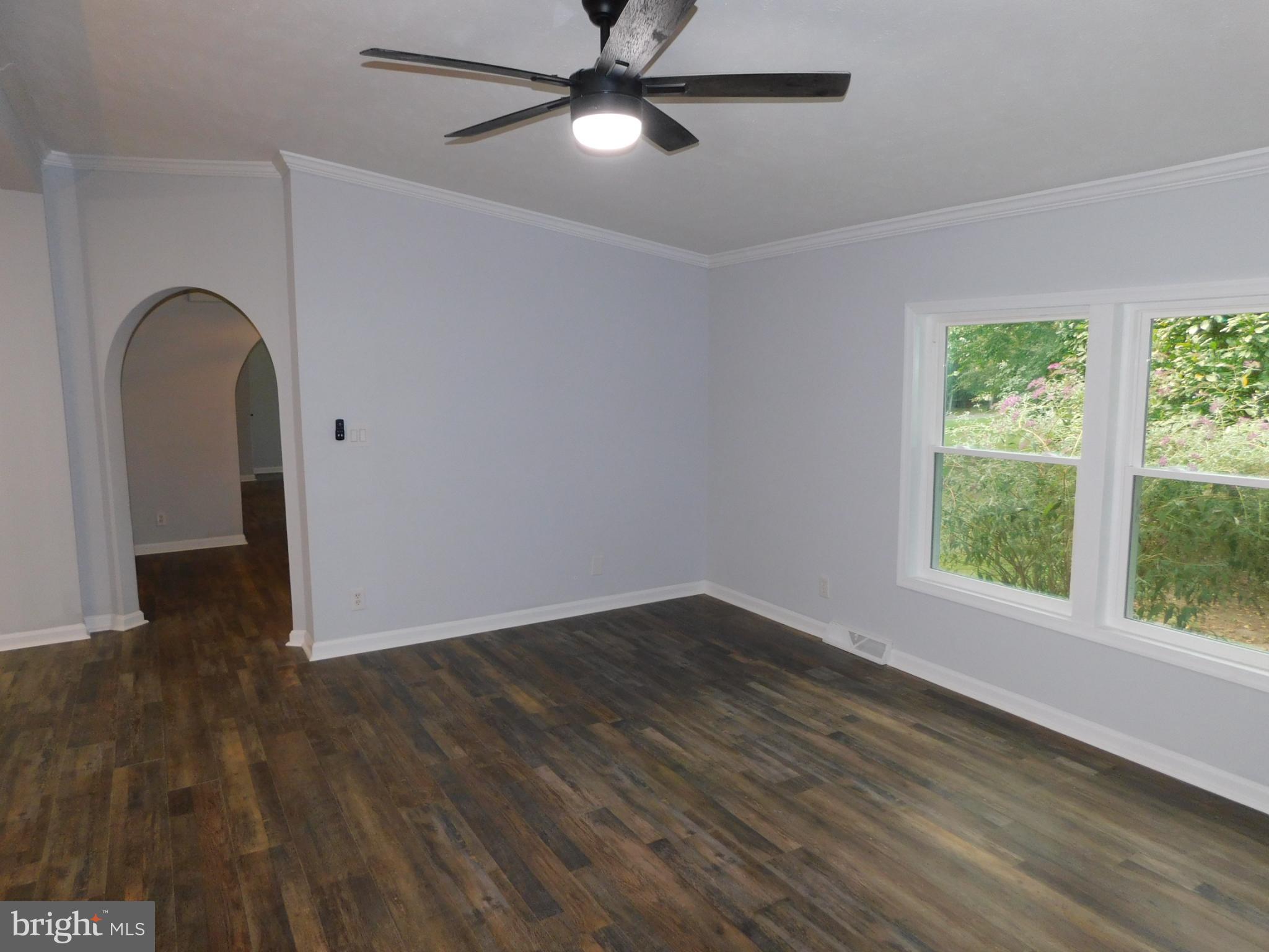 2608 Hunting Quarter Road Houston, DE 19954 - Photo 13 of 58 a view of empty room with wooden floor and fan