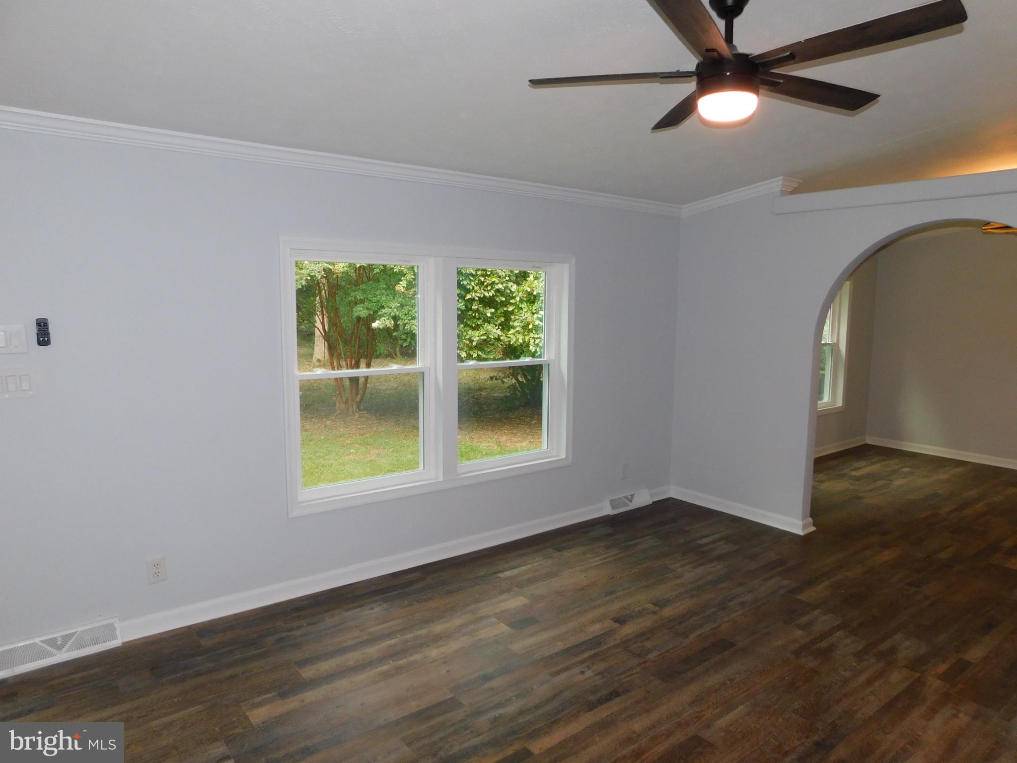 2608 Hunting Quarter Road Houston, DE 19954 - Photo 20 of 58 a view of an empty room with wooden floor and a window