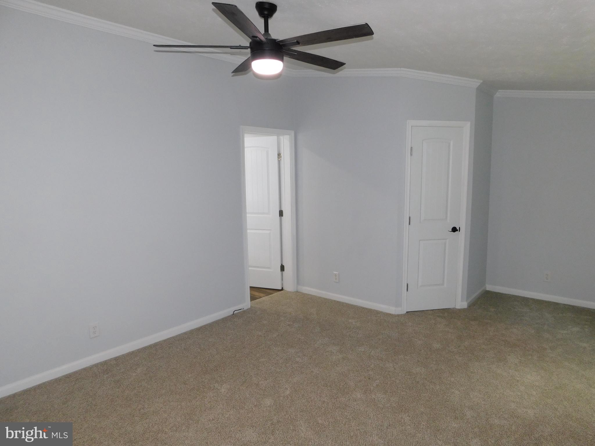 2608 Hunting Quarter Road Houston, DE 19954 - Photo 25 of 58 an empty room with a window and a fan