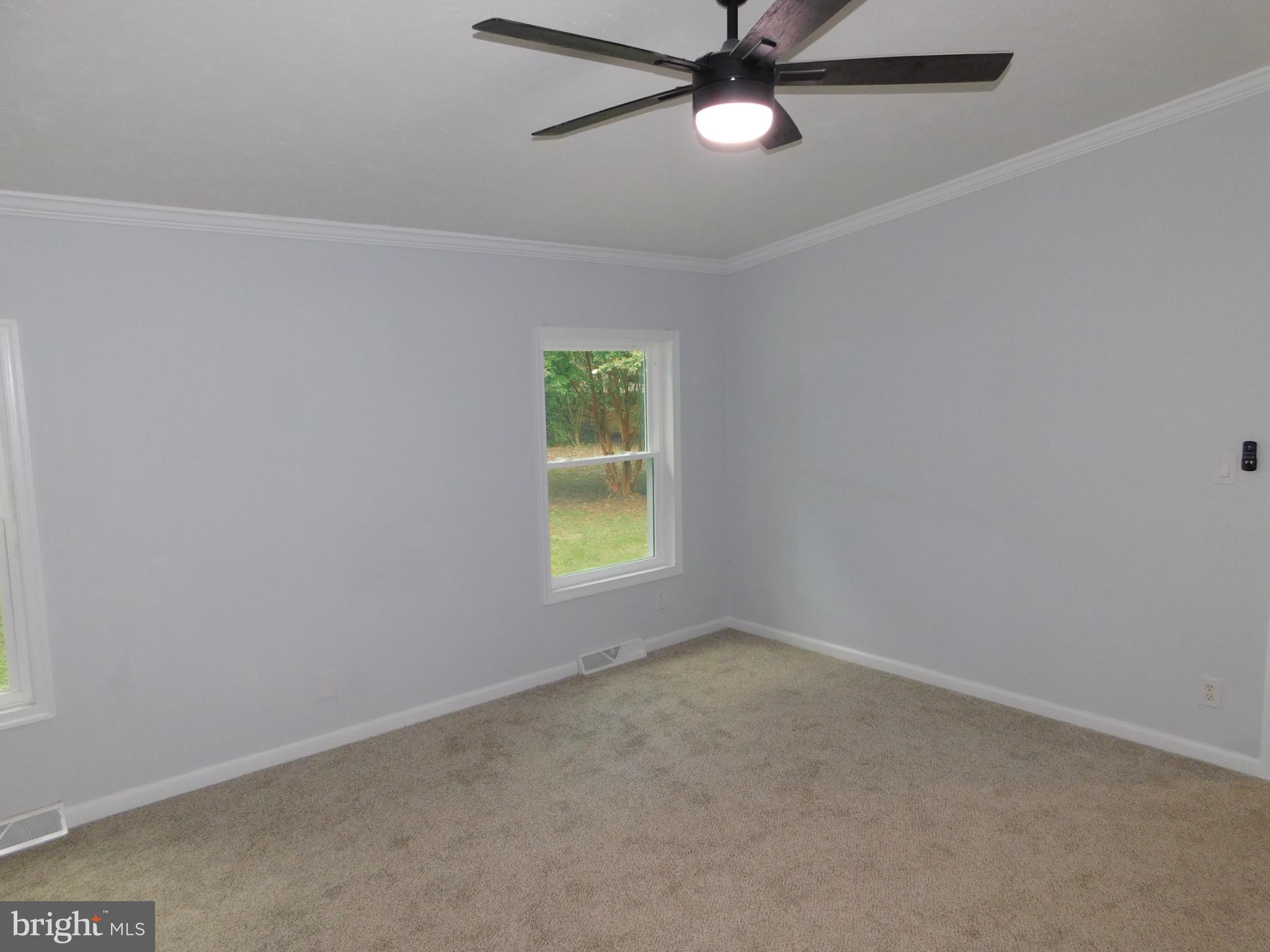 2608 Hunting Quarter Road Houston, DE 19954 - Photo 27 of 58 an empty room with a window and a fan