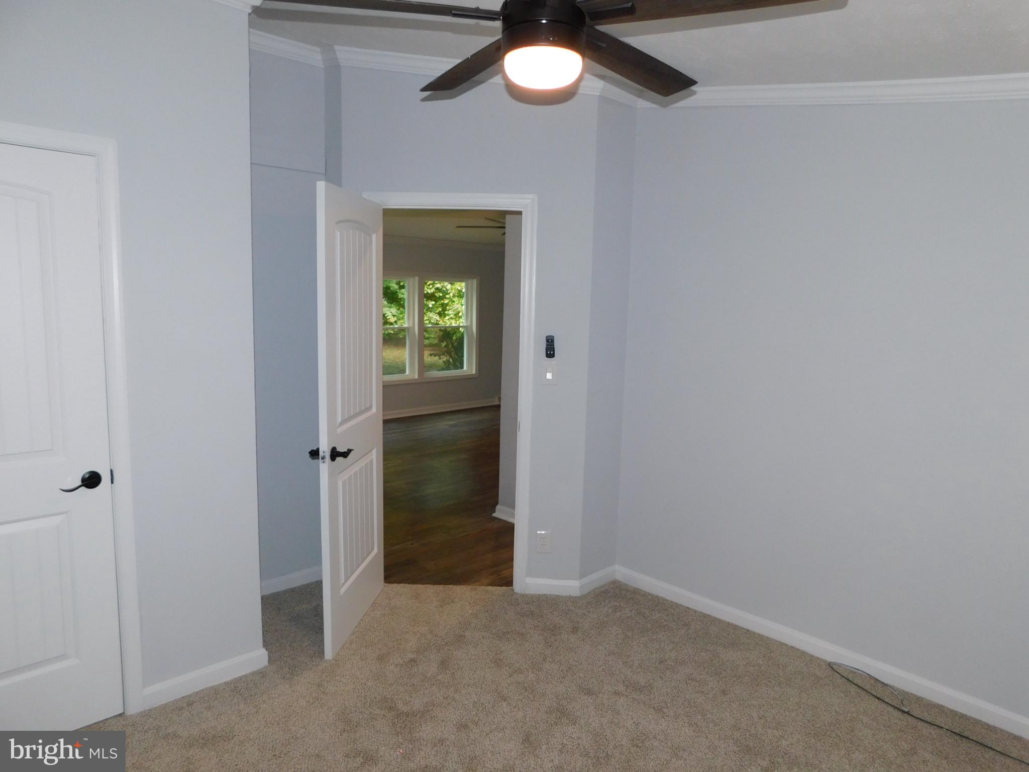 2608 Hunting Quarter Road Houston, DE 19954 - Photo 37 of 58 an empty room that has a chandelier fan