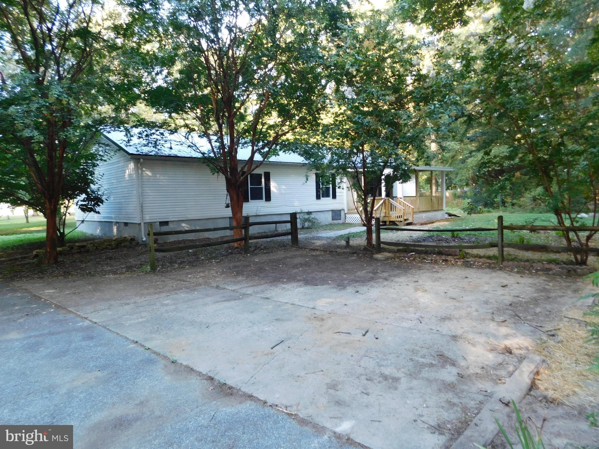 2608 Hunting Quarter Road Houston, DE 19954 - Photo 49 of 58 a view of a house with a yard and sitting area
