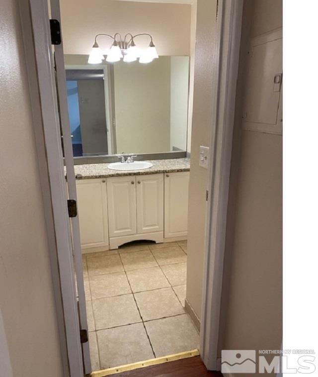 2555 Clear Acre Lane, Unit 933 Reno, NV 89512 - Photo 11 of 14 a view of a bathroom with mirror and window