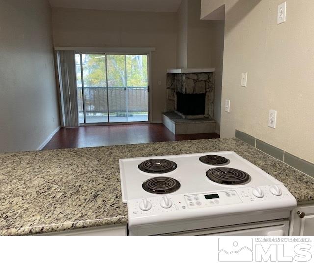 2555 Clear Acre Lane, Unit 933 Reno, NV 89512 - Photo 14 of 14 a kitchen with a stove and a microwave