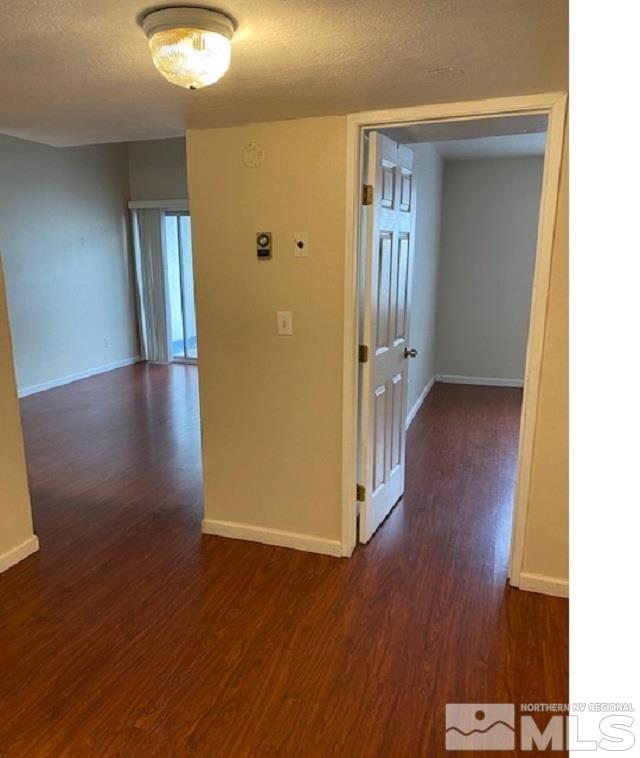 2555 Clear Acre Lane, Unit 933 Reno, NV 89512 - Photo 8 of 14 an empty room with wooden floor and windows