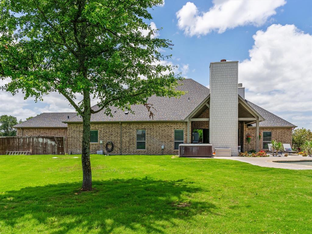 111 Old Base Road Aurora, TX 76078 - Photo 33 of 38 Beautifully updated custom home situated on a one-acre lot in Aurora Vista with mature landscaping, stone accents, and exceptional curb appeal.