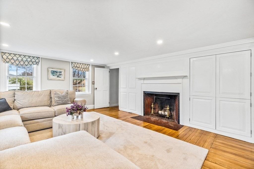 597 Main Street Hingham, MA 02043 - Photo 11 of 42 a living room with furniture and a fireplace