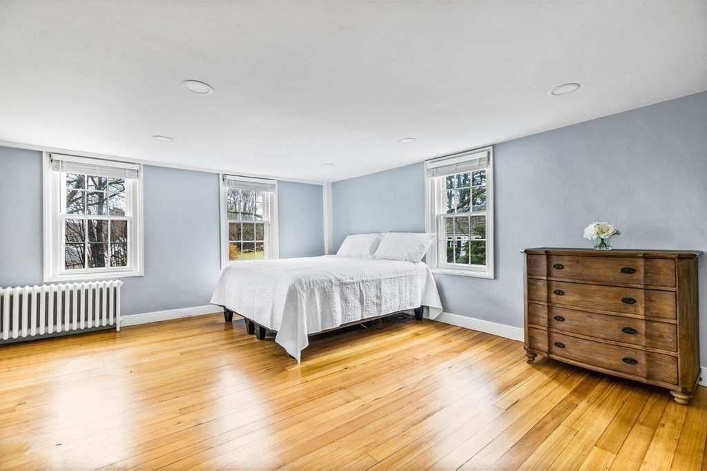 597 Main Street Hingham, MA 02043 - Photo 18 of 42 a bedroom with a bed and a window