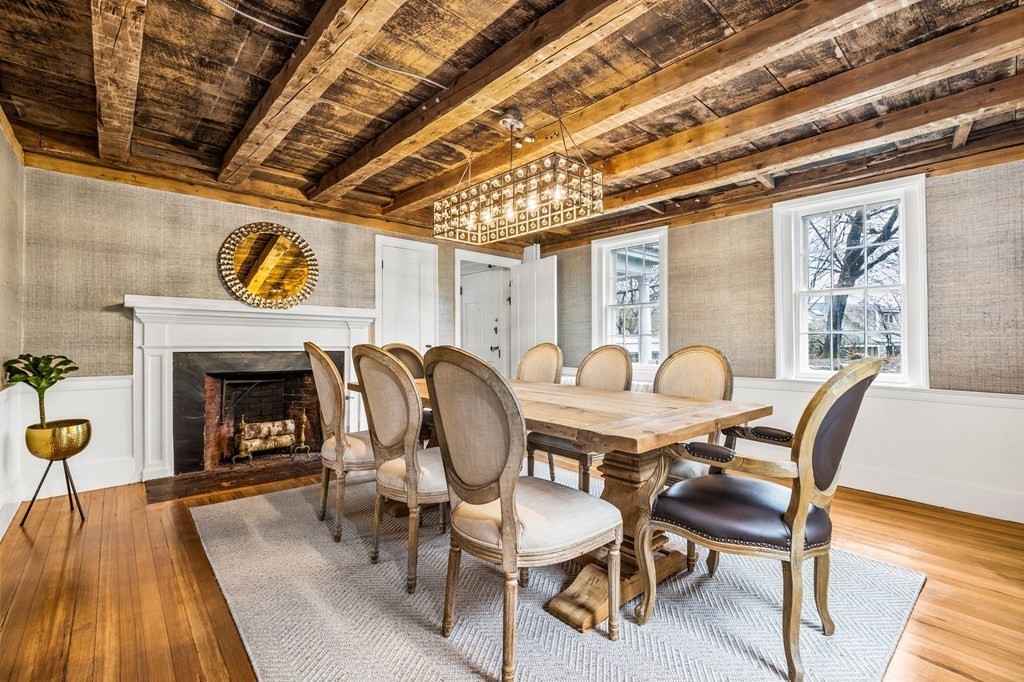 597 Main Street Hingham, MA 02043 - Photo 2 of 42 a view of a dining room with furniture wooden floor and a fireplace