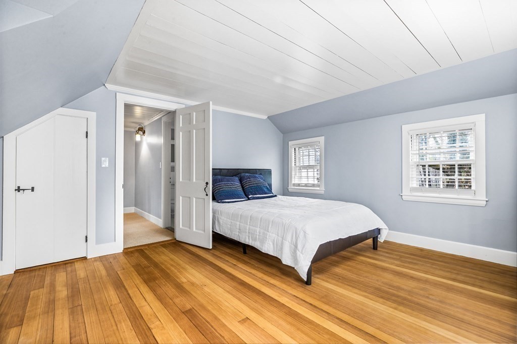 597 Main Street Hingham, MA 02043 - Photo 26 of 42 a spacious bedroom with a bed and a window