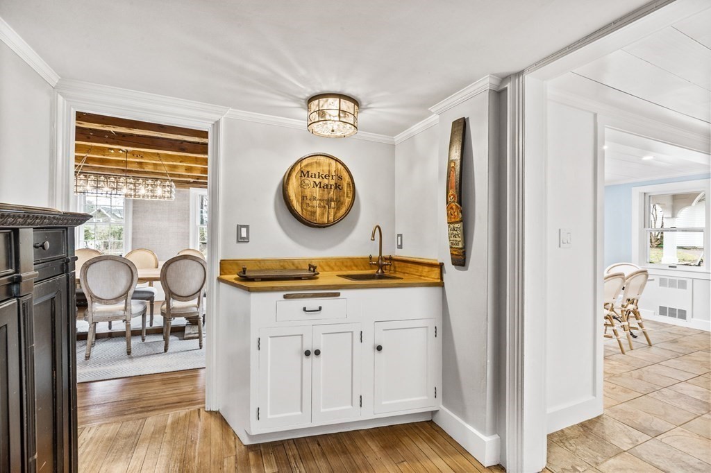 597 Main Street Hingham, MA 02043 - Photo 4 of 42 a living room with furniture and a clock