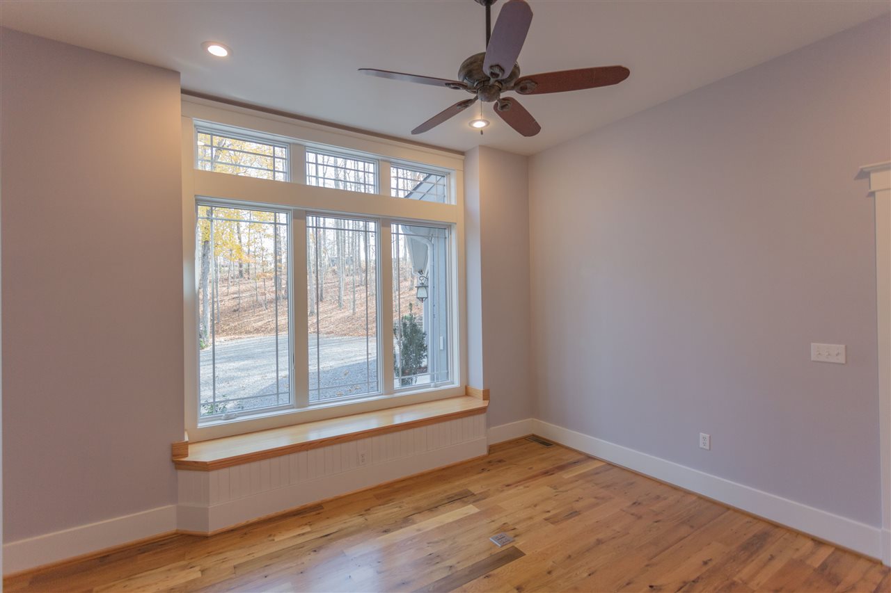 110 East Ridge Drive Lexington, VA 24450 - Photo 17 of 50 a view of an empty room with a window and wooden floor
