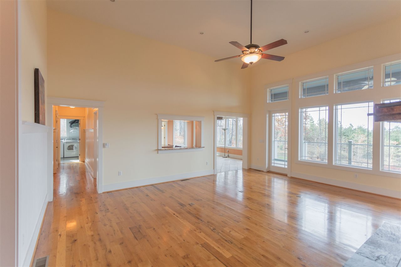 110 East Ridge Drive Lexington, VA 24450 - Photo 38 of 50 a view of an empty room with a window and wooden floor