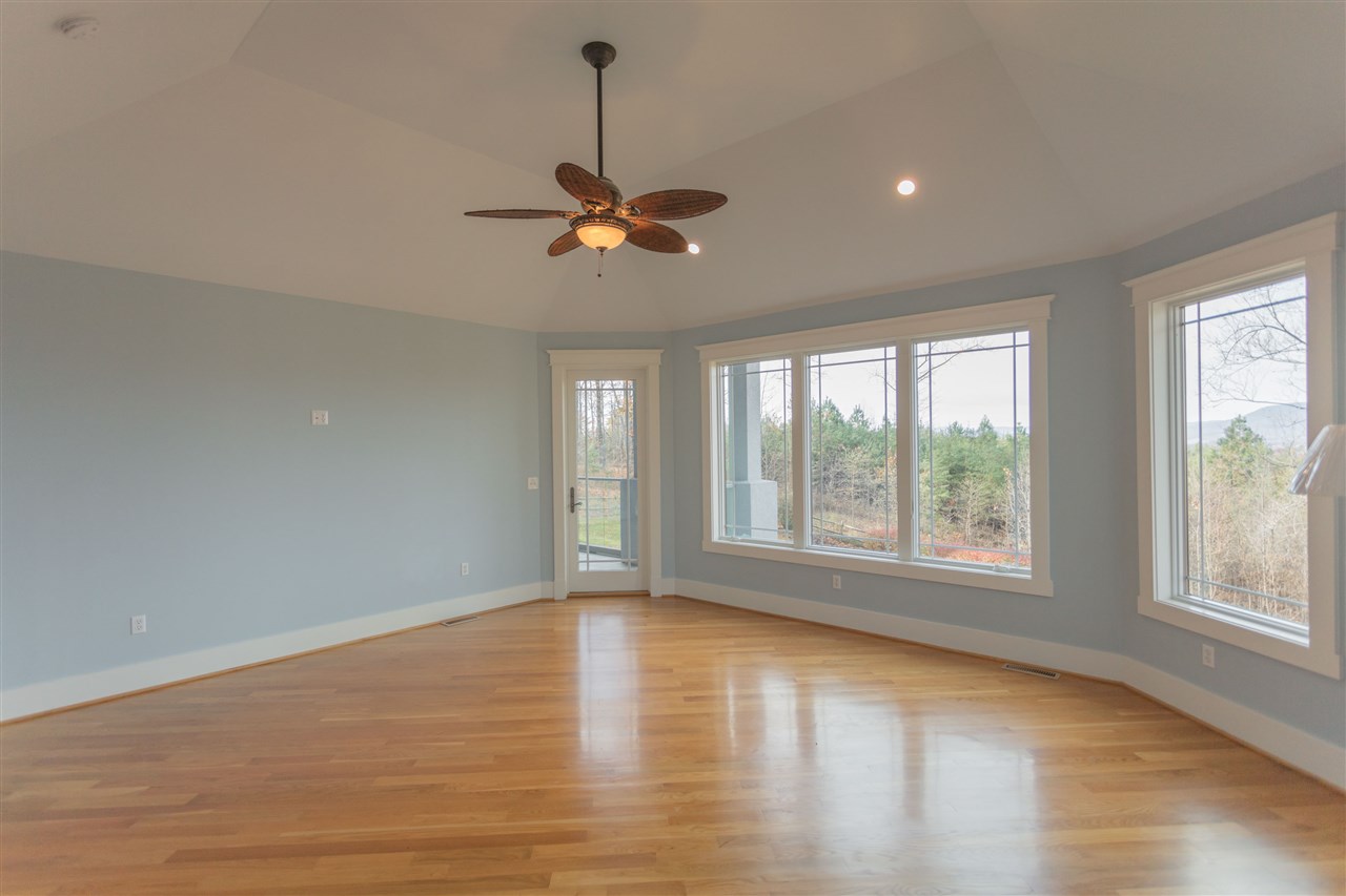 110 East Ridge Drive Lexington, VA 24450 - Photo 42 of 50 a view of an empty room with a window and wooden floor
