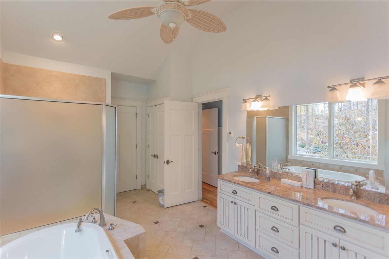 110 East Ridge Drive Lexington, VA 24450 - Photo 50 of 50 a spacious bathroom with a granite countertop sink a mirror and a bathtub