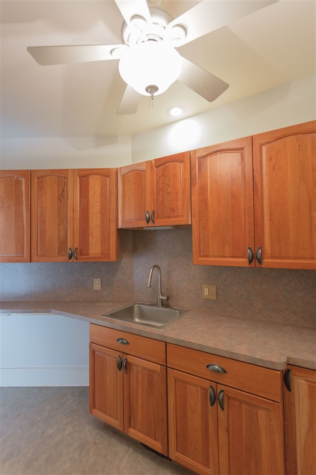 110 East Ridge Drive Lexington, VA 24450 - Photo 5 of 50 a kitchen with granite countertop a sink cabinets and stainless steel appliances