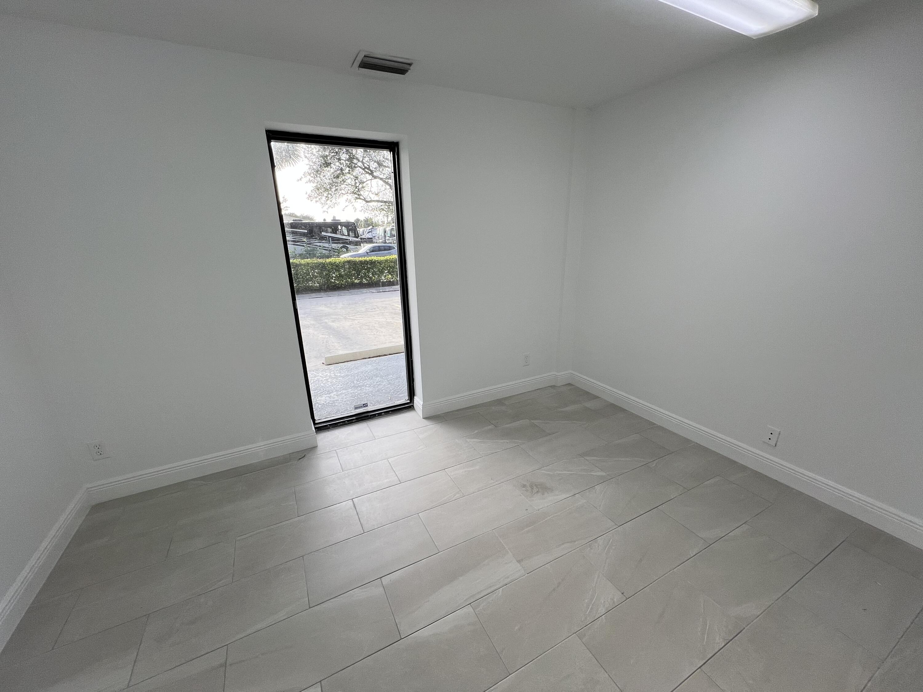 500 Commerce Way West, Unit 8 Jupiter, FL 33458 - Photo 3 of 9 an empty room with a window