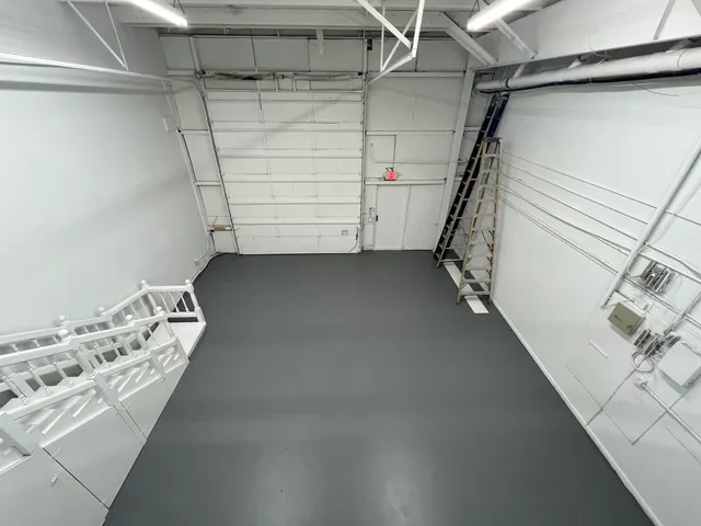 a view of a room with racks on the wall