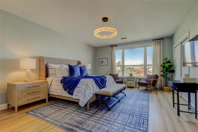 a spacious bathroom with a double vanity sink a mirror and a shower