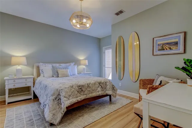 a bathroom with a granite countertop sink toilet a mirror a vanity and shower