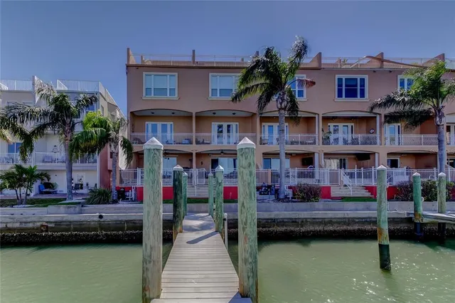 a swimming pool view with a outdoor seating