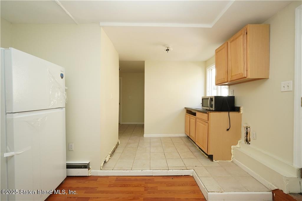 301 Lightner Avenue Staten Island, NY 10314 - Photo 14 of 17 a view of a kitchen with electric appliances