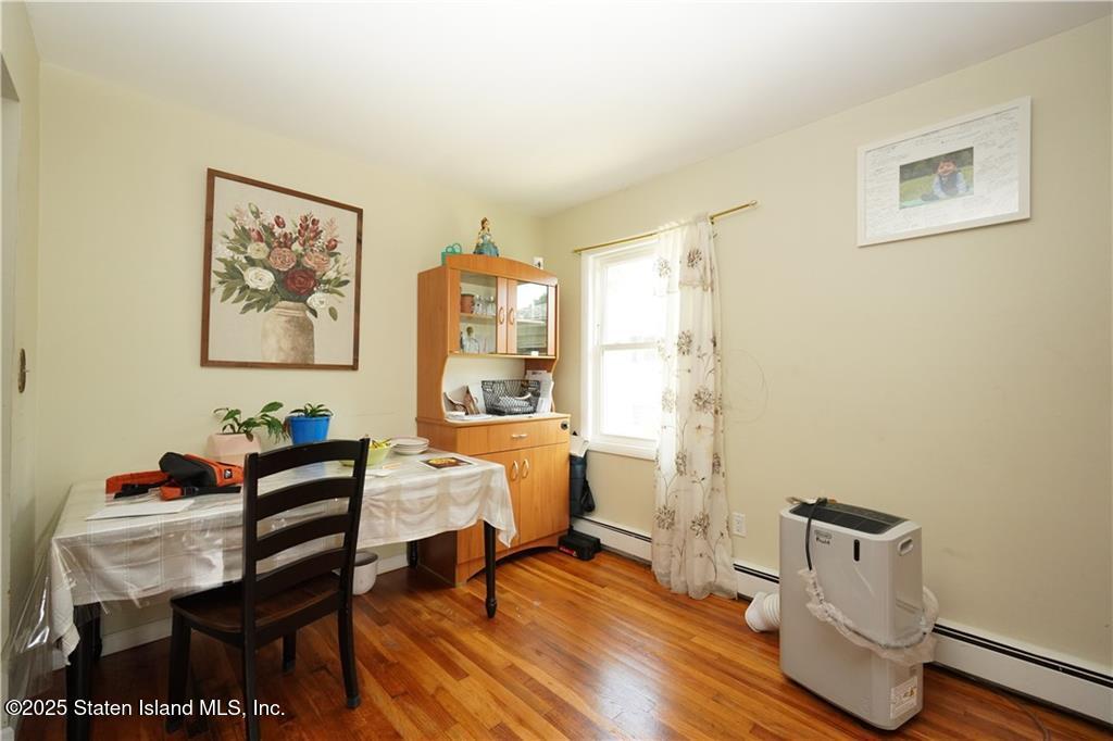 301 Lightner Avenue Staten Island, NY 10314 - Photo 5 of 17 a living room with furniture and a table