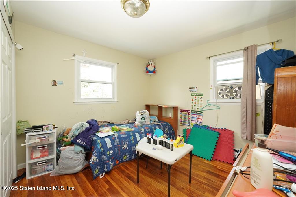 301 Lightner Avenue Staten Island, NY 10314 - Photo 6 of 17 a living room with furniture and a window