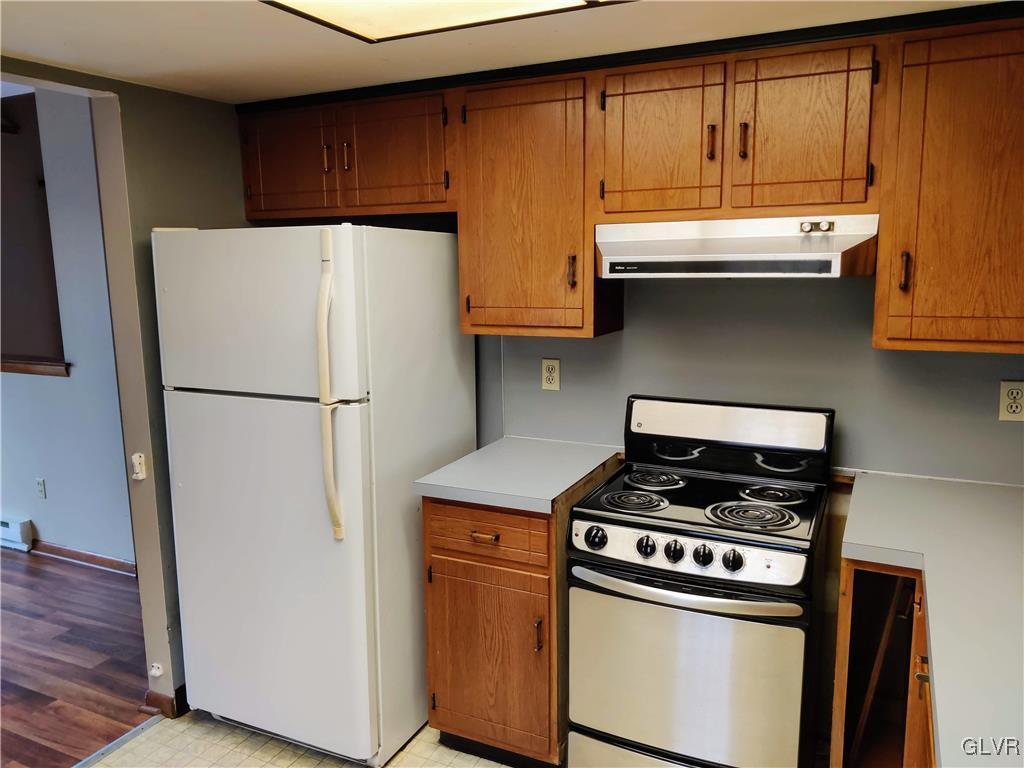 2116 Mountain Road Slatington, PA 18080 - Photo 23 of 43 a kitchen with stainless steel appliances a refrigerator a stove and a sink