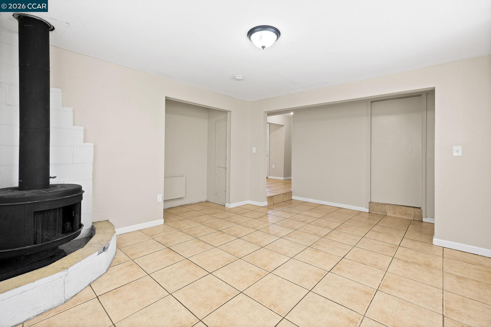 4820 Blum Road Martinez, CA 94553 - Photo 15 of 46 a view of an empty room with a fireplace