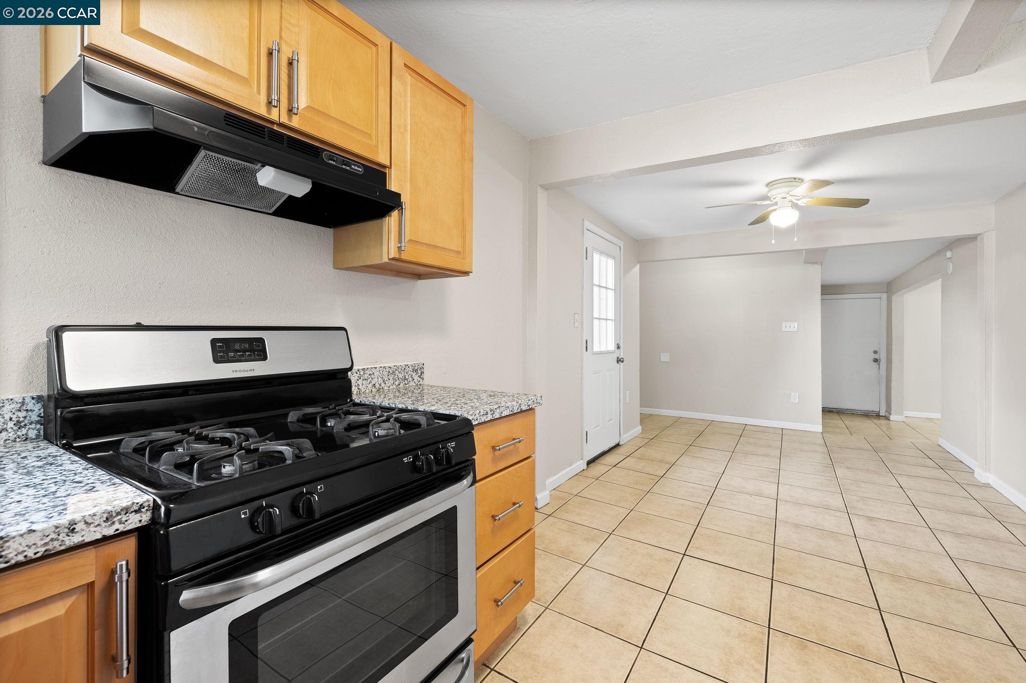 4820 Blum Road Martinez, CA 94553 - Photo 32 of 46 a kitchen with stainless steel appliances granite countertop a stove a sink and a microwave