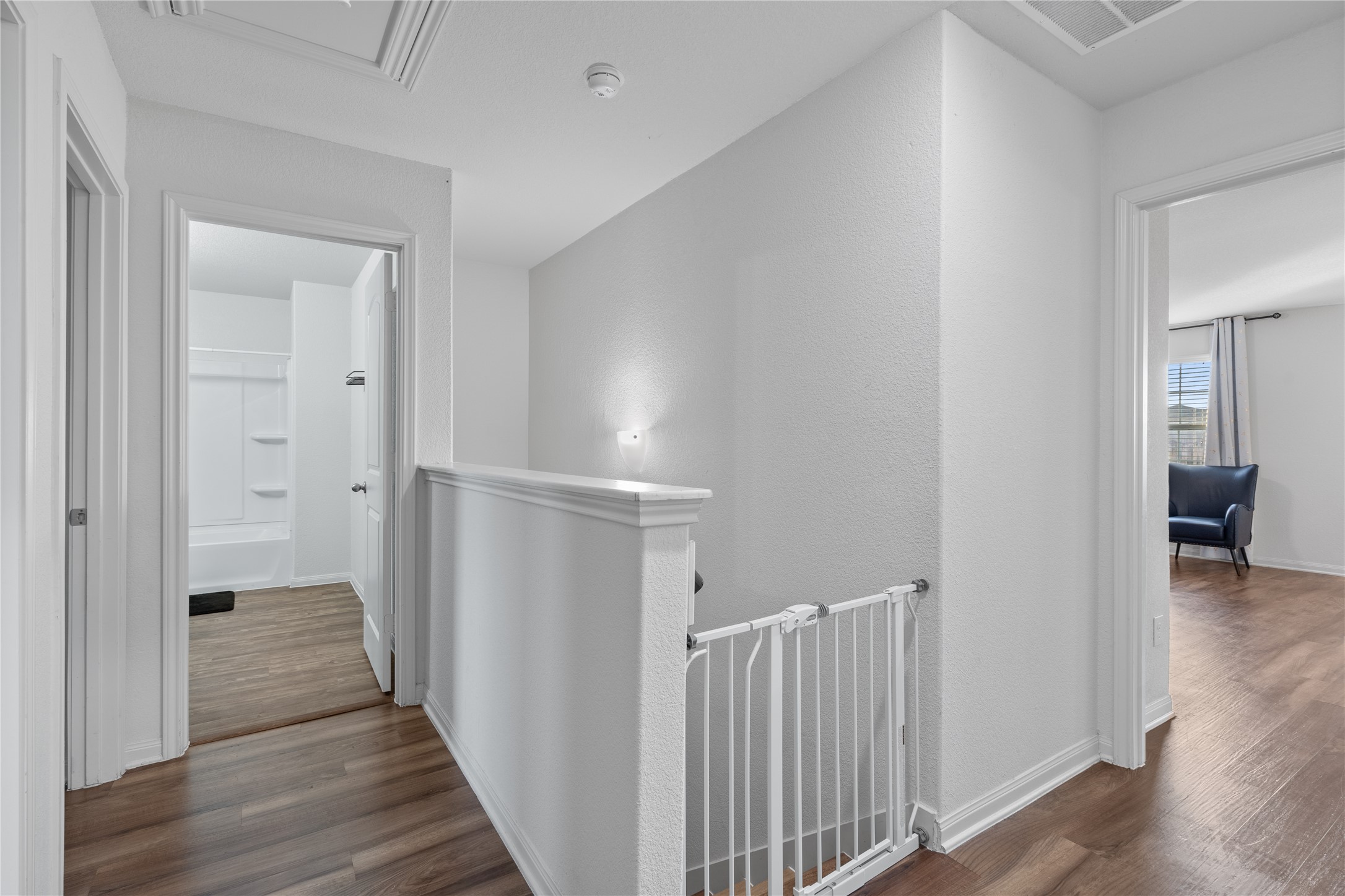 20205 Grover Cleveland Way Manor, TX 78653 - Photo 15 of 26 a view of a hallway with wooden floor