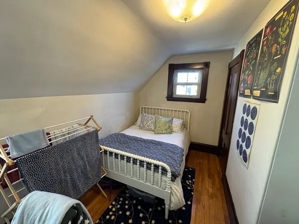 a bedroom with furniture and a window