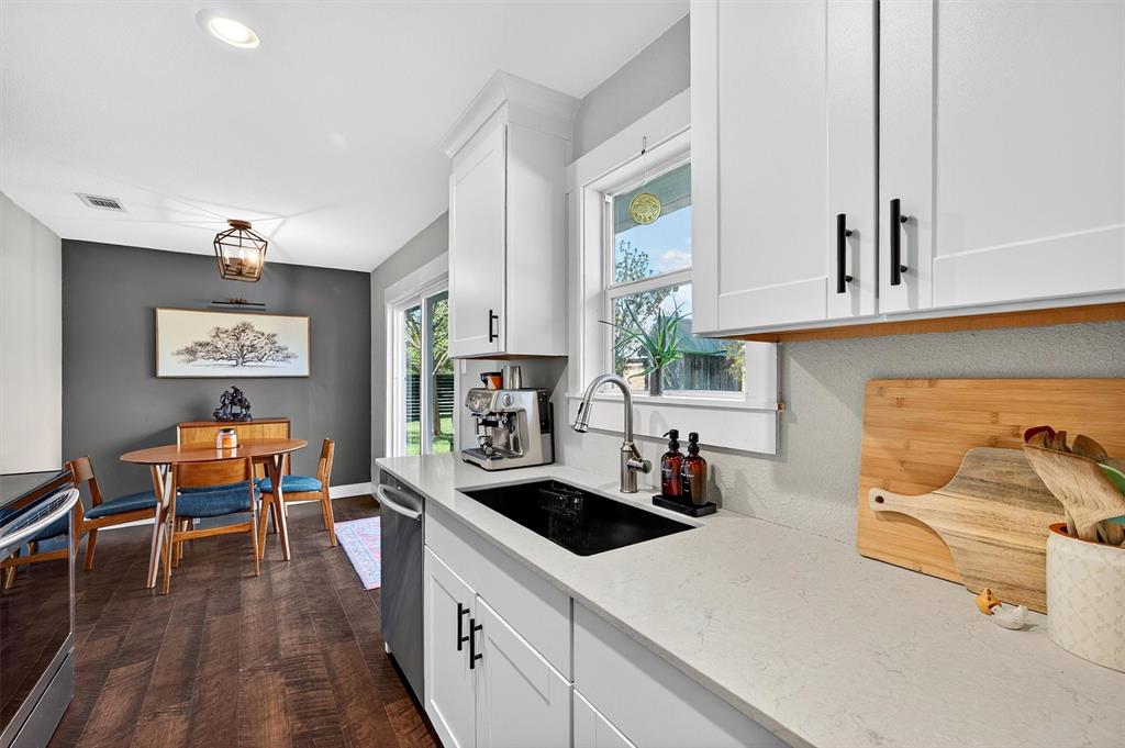 5816 Luella Road Sherman, TX 75090 - Photo 11 of 36 a kitchen with stainless steel appliances a stove a sink a refrigerator and cabinets