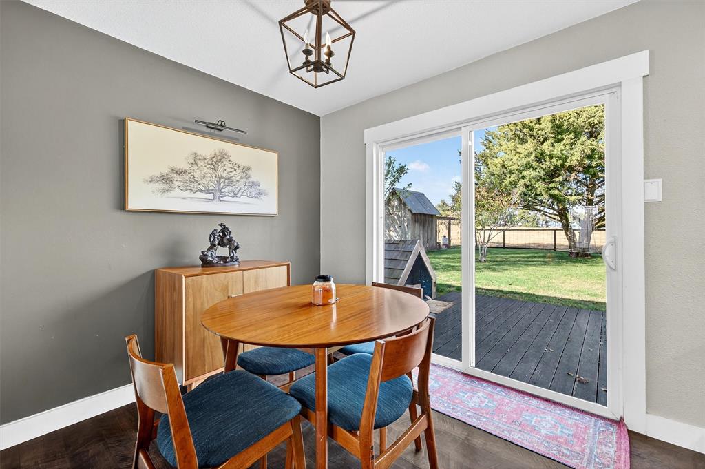 5816 Luella Road Sherman, TX 75090 - Photo 12 of 36 a view of a dining room with furniture window and wooden floor