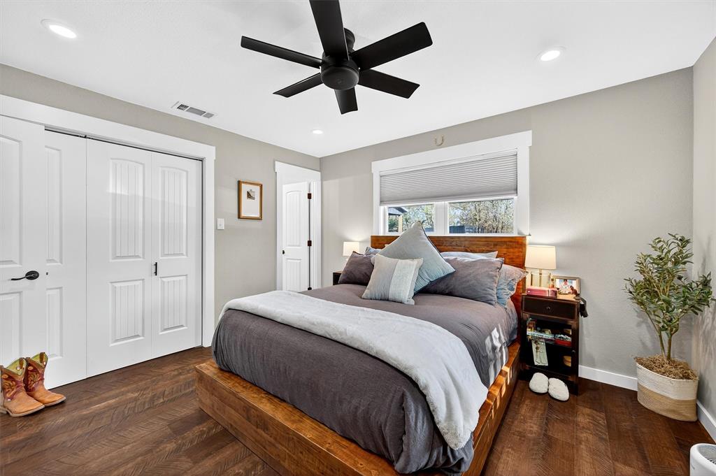 5816 Luella Road Sherman, TX 75090 - Photo 14 of 36 a bedroom with a bed and a chandelier